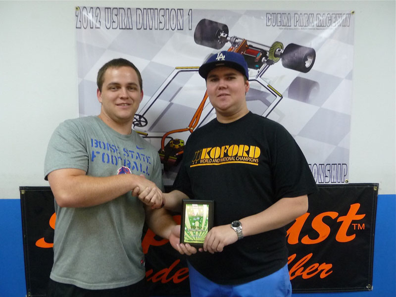 Cody accepting his 5th place plaque for International 15's from James Grinstead