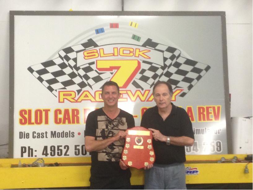 Winners holding the perpetual trophy.