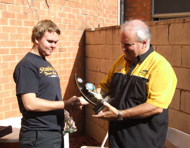 Cody Bramble Being given his trophy for a very good Win in The 1/24th CanAm/Sports GT, from I'd say a Happy Dad !!