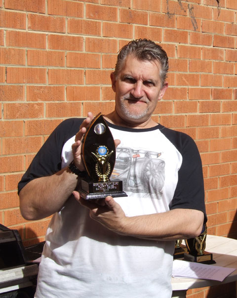 Dale Andersen with his 3rd place trophy in 1/24th CanAm/Sports GT.<br />Always a threat no matter What he's racing!