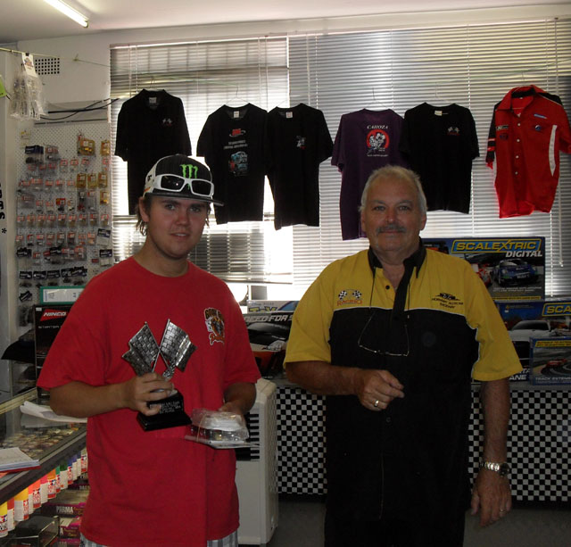 Cody Bramble happily accepting his Trophy and 'booty' for his Fine Win in CanAm/SportsGT