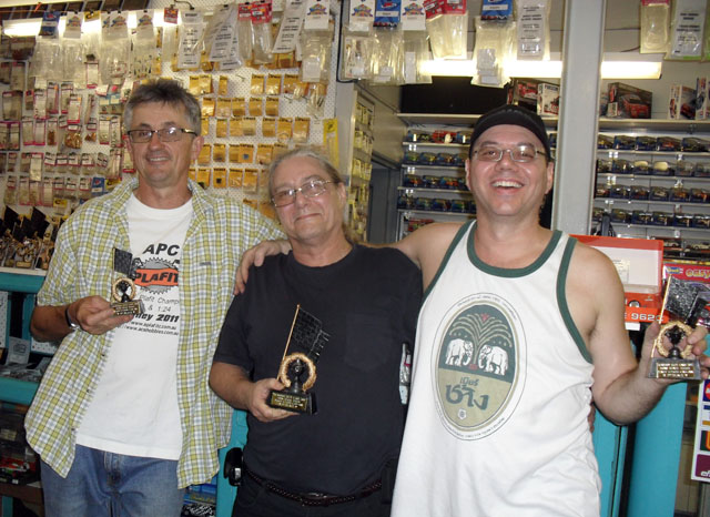 The Very Happy and Probably Still Amazed 1/24th CanAm/Historics Podium.<br />L to R; Kim Axton 3rd, Stewart Amos 1st and Troy Boldy 2nd.